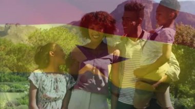 Animation of flag of ghana over african american family. Patriotism, family and digital interface concept digitally generated video.