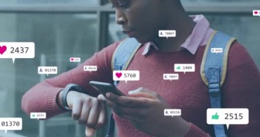 Animation of social media icons with growing numbers over african american woman using smartphone. Global social media, technology and digital interface concept digitally generated video.