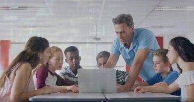 Animation of male teacher teaching multiracial students with laptop over infographic interface. Digital composite, multiple exposure, education, database, childhood, e-learning, technology.