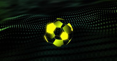 Image of digital football over green spots on black background. Global sport, technology and digital interface concept digitally generated image.