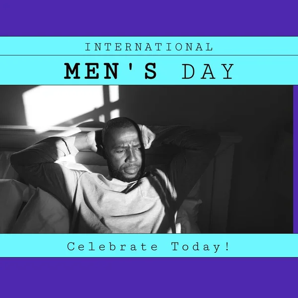 Digital image of thoughtful african american mid adult man at home, international men\'s day text. Copy space, celebration, awareness, holiday, recognizing contributions and achievements.