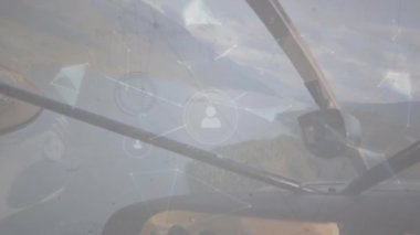 Animation of network of profile icons and plexus networks over cockpit of a plane flying in the sky. Global networking and aviation technology concept