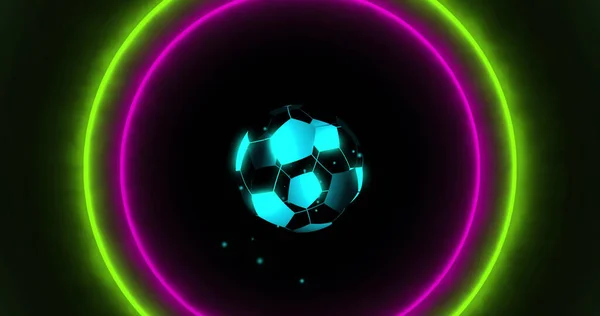 Image of digital football over neon circles on black background. Global sport, technology and digital interface concept digitally generated image.