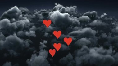 Digital animation of multiple clouds white spots falling against clouds in sky. Valentines day celebration and love concept.