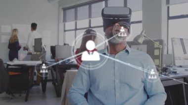 Animation of network of connections with icons over caucasian businessman using smartphone. Global connections digital interface technology and networking concept digitally generated video.