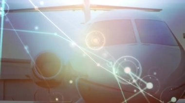 Animation of network of connections over airplane at an airport. Global networking and aviation business technology concept