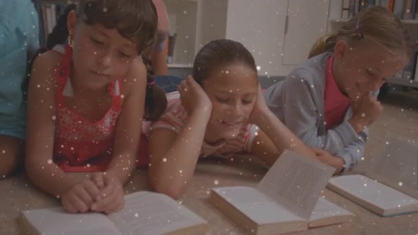 Animation Particles Caucasian Siblings Reading Books While Lying Floor Digital — Stock Video