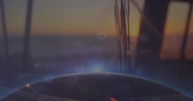 Composite image of data processing against caucasian girl holding digital tablet at home. Global business data processing finance crisis and recession concept digitally generated video.