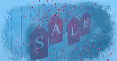 Animation of confetti falling over sale text at christmas. Christmas, tradition and celebration concept digitally generated video.