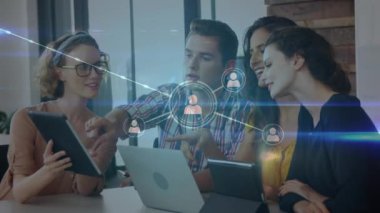 Animation of network of connections over caucasian business people in office. Global business and digital interface concept digitally generated video.