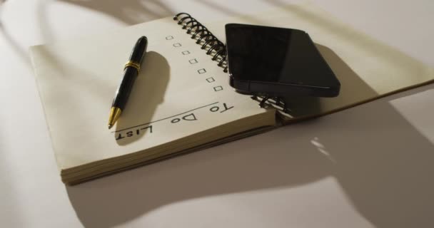 Video Notebook List Copy Space Smartphone Pen Wooden Surface Business — Stock videók