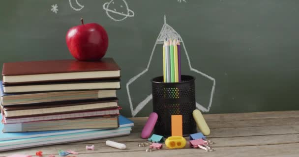 Video School Supplies Books Wooden Table Blackboard Education Learning Creativity — Stockvideo