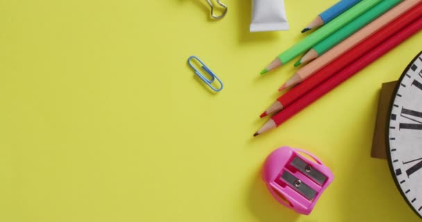 Video School Supplies Notebooks Paper Clips Pens Yellow Background Education — Vídeo de Stock