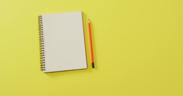 Video Notebook Copy Space Pencil Yellow Background School Equipment Tools — стоковое видео
