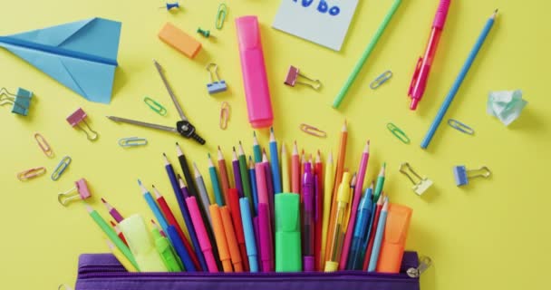 Video School Supplies Notebooks Paper Clips Pens Yellow Background Education — Vídeo de stock