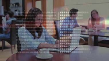 Animation of binary code and graph bars over caucasian woman drinking coffee and working on laptop. Digital composite, multiple exposure, coding, report, business, drink and technology concept.