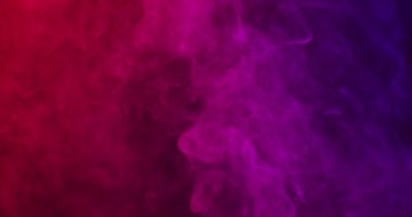 Video of white smoke with red light on black background. Halloween, autumn, tradition and celebration concept.