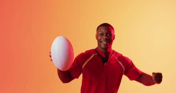 Portrait Happy African American Male Rugby Player Raising Hands Orange — Stock Video