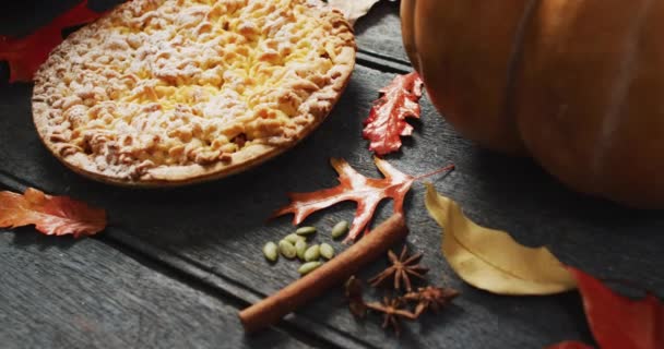 Video Autumn Leaves Pumpkin Spices Pie Wooden Background Halloween Autumn – stockvideo