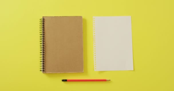 Video Notebook Empty Sheet Copy Space Pencil Yellow Background School — Videoclip de stoc