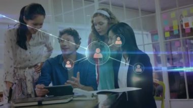 Animation of network of connections over caucasian business people in office. Global business and digital interface concept digitally generated video.