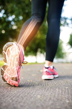 Digital composite of Jogger experiencing ankle  pain