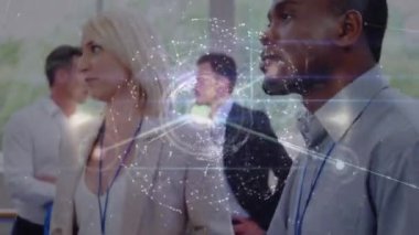 Animation of network of connections over group of diverse businesspeople discussing at office. Global networking and business technology concept