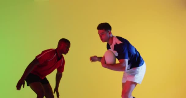 Diverse Male Rugby Players Rugby Ball Playing Yellow Lighting Sport — Stock Video