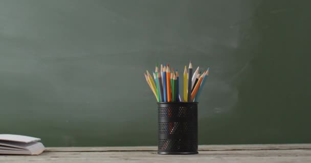 Video School Supplies Books Wooden Table Blackboard Education Learning Creativity — Vídeo de Stock