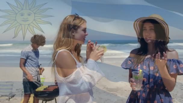 Composite Video Waving Argentina Flag Two Caucasian Women Enjoying Drinks — Vídeos de Stock