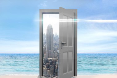 Digital composite of cityscape seen from open door on beach