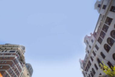 Buildings in city against clear sky