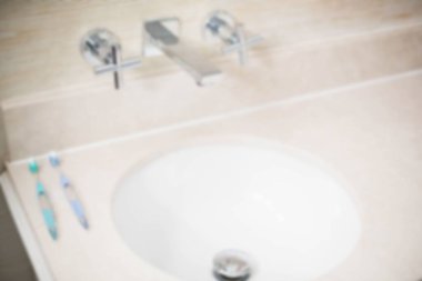 High angle view of toothbrush by wash bowl in bathroom
