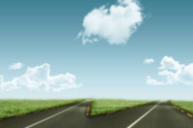 Empty forked road against sky 