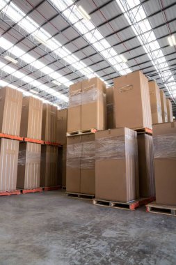 Cardboard box arranged in warehouse