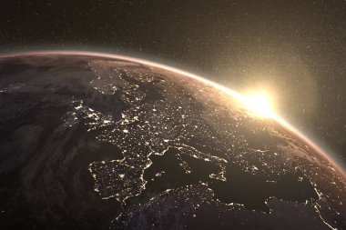 Digitally composite image of rising sun behind planet Earth