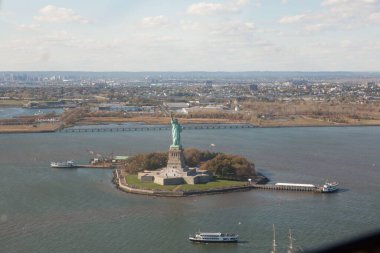 High angle view of Statue of Liberty in sea on sunny day
