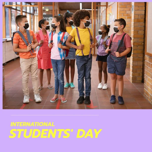 Composition of international students' day text with diverse schoolchildren wearing face masks. Students day and celebration concept digitally generated image.