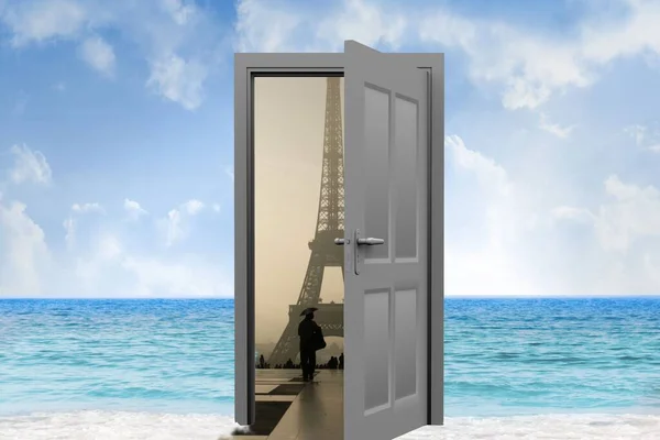 Digital image of open door with Eiffel Tower on sea against sky