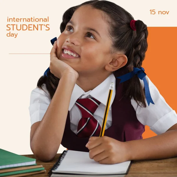 Composition of international student\'s day text over biracial schoolgirl. International student\'s day and celebration concept digitally generated image.