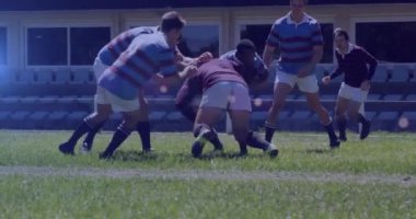 Animation of glowing lights over diverse rugby players in sports stadium. rugby, teamwork, sports and competition concept digitally generated video.