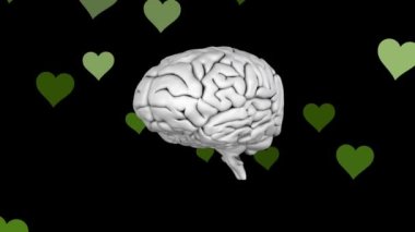 Human brain icon spinning over multiple green heart icons floating against black background. mental health day awareness concept