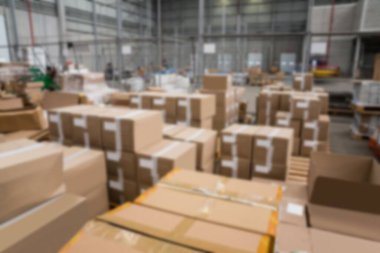 Cardboard boxes arranged in distribution warehouse