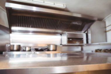 Utensils on counter in commercial kitchen at restaurant