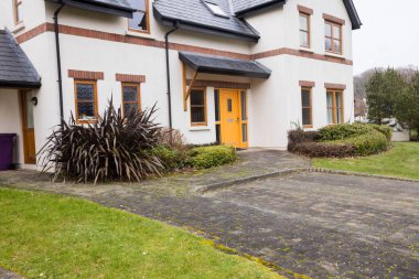 Footpath outside house on sunny day