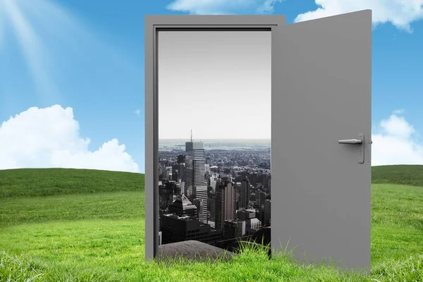 Digital image of open door with city on grassy landscape against sky