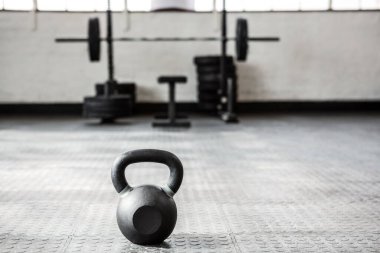 Close-up of kettlebell on floor at gym