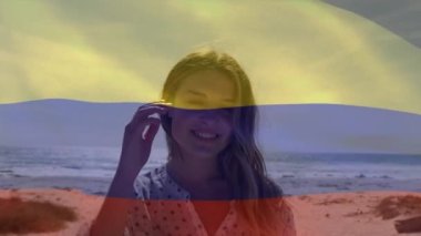 Hollanda bayrağının sahilde çocuklu beyaz bir anne üzerinde canlandırılması. Vatanseverlik ve kutlama konsepti dijital olarak oluşturulmuş video.