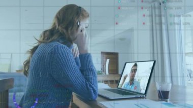 Animation of data processing over caucasian businesswoman having video call with colleague. Global business and digital interface concept digitally generated video.