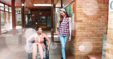 Arkadaşlarıyla birlikte engelli melez öğrencilerin üzerinde ışıklı noktaların canlandırılması. Uluslararası Engelliler Günü konsepti dijital olarak oluşturulmuş video.